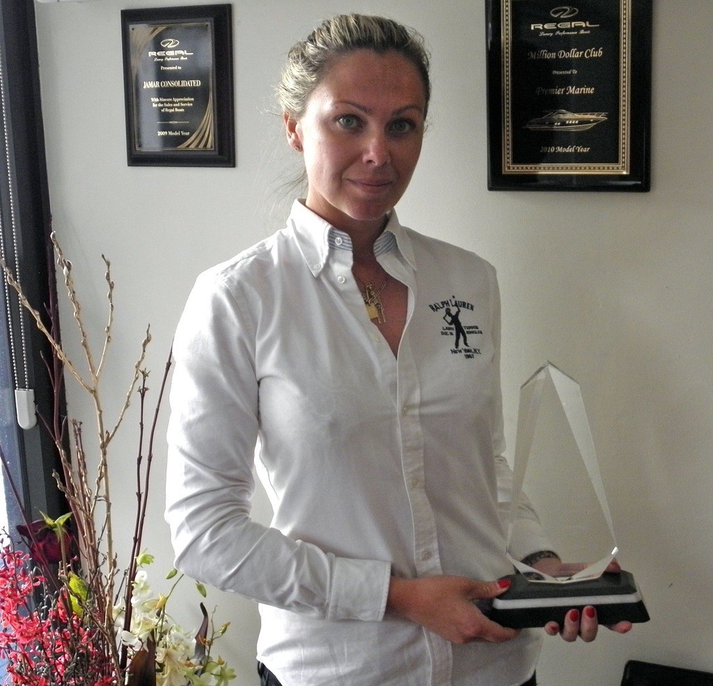Premier Marine Operations Manager Lee Poulson with the Regal Marine award as International Dealer of the Year. - Premier Marine © Premier Marine .